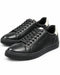 Par de zapatillas Perry Ellis negras de cuero liso para caballero, con talón blanco y suela negra